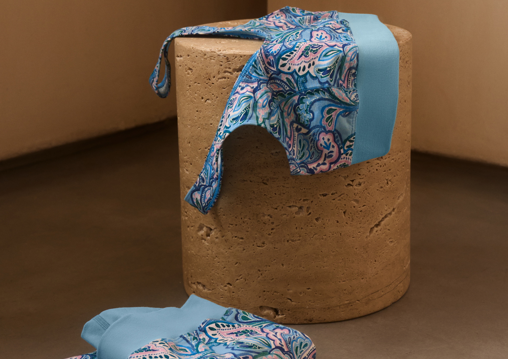 CALIDA bustier with soft waistband lies on a pad for quick drying.