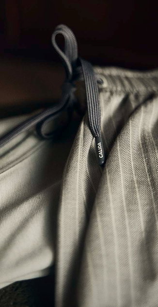 A pair of trousers from the RMX Sleep Superlight series is shown.