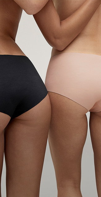 Two briefs from the Natural Skin series in the colours black and deep taupe are shown in the image.