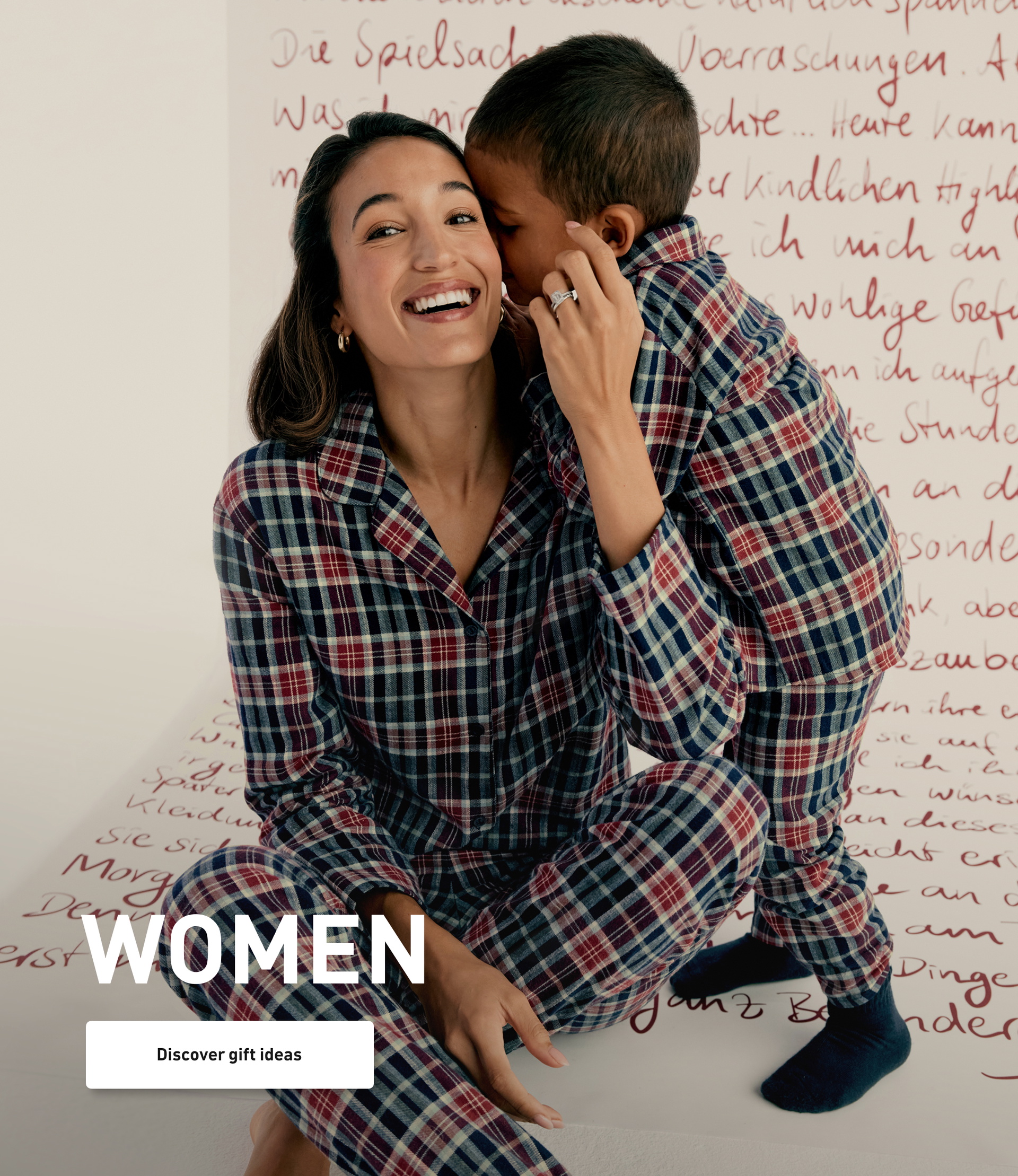 Model wears a plaid flannel pajama set matching with a child and presents winter nightwear for the whole family.