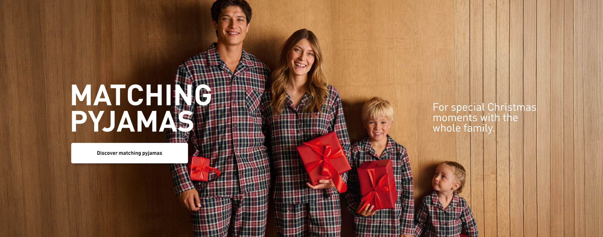 Pajamas in matching styles. Family in coordinated flannel pajamas with a check pattern, staged for shared Christmas moments.